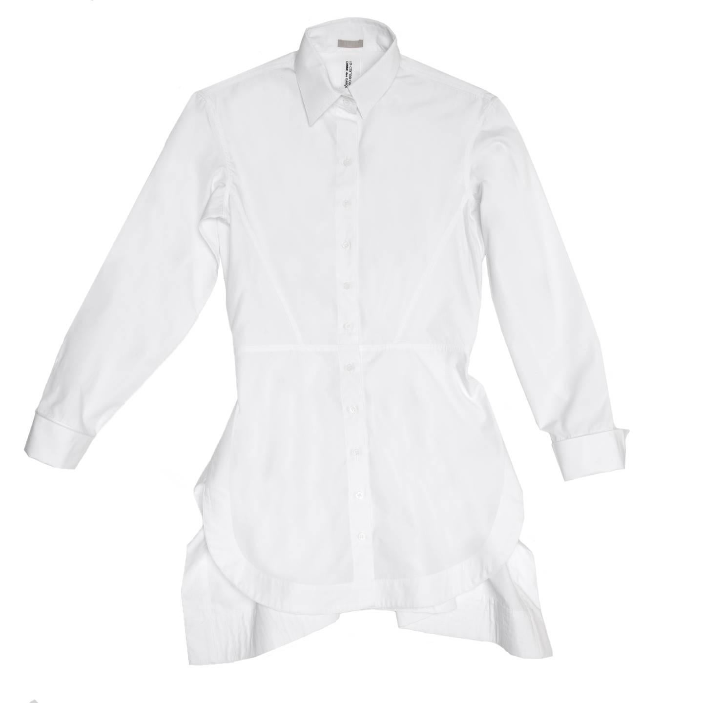 White plain cotton long shirt with peplum waist seam at front and belt insert at back. The skirt is flared and both the back body and skirt are ruched. The front hem is round while the back is squared; the cuffs are french style, with turn backs and