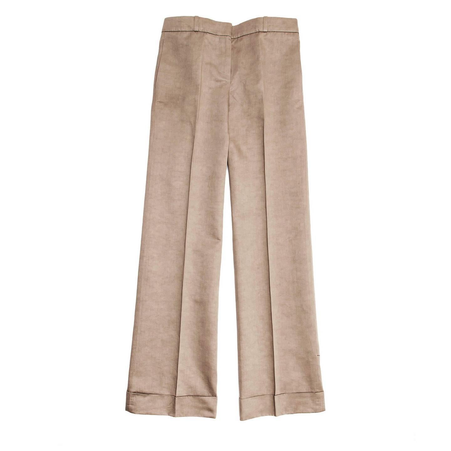 Khaki cotton and hemp blend beautiful cut of a classic trouser with a delicate boot leg on a palazzo style, flat front, slash pockets and turn-up hem.

Size  44 French sizing

Condition  Excellent: never worn with tags