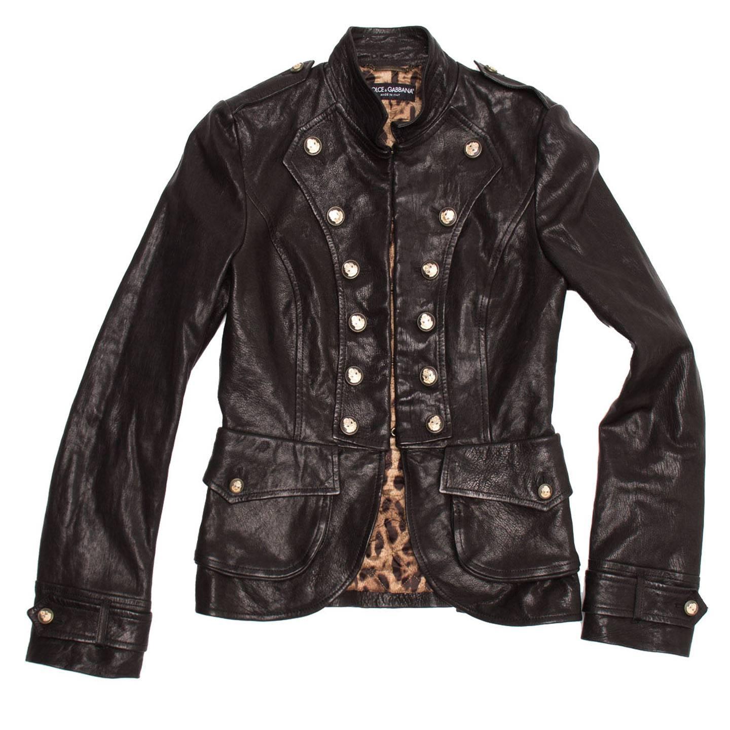 Black distressed leather fit and flare waist length military jacket with signature leopard print interior, broad patch/flap pockets, mandarin collar, and gold button detailing.

Size  44 Italian sizing

Condition  Excellent: worn a few times