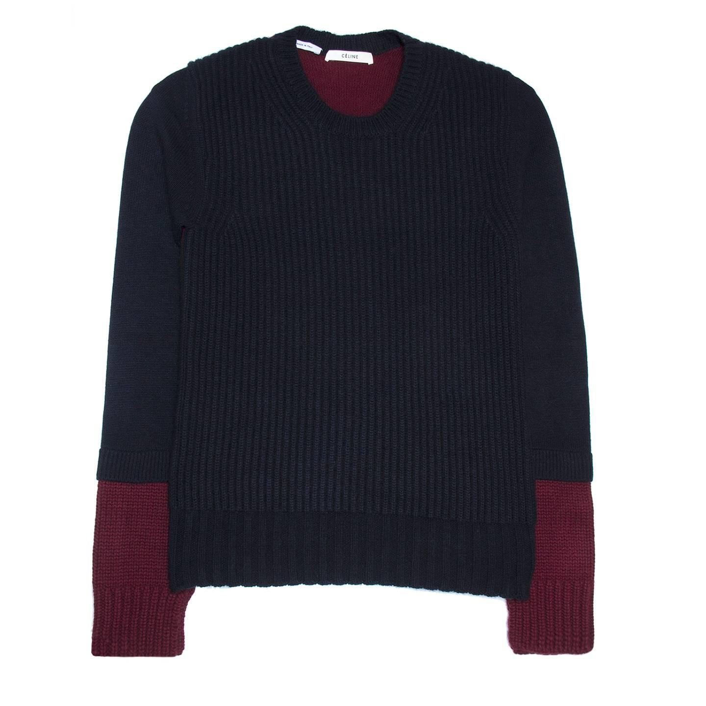 Cashmere crew neck knit pullover with navy blue front and 3/4 sleeves, while back and bottom sleeves part are burgundy. The font and the bottom part of the sleeves are broad knit while the rest of the sweater is fine knit. The burgundy inserts at