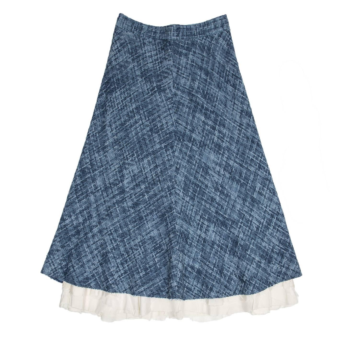 Melange of different shades of sky blue woven chenille like cotton stripes. The skirt is high waisted, ankle length with ivory inserts at hem and it has an a-line volume. Made in U.S.A.

Size  10 US sizing

Condition  Excellent: worn a few times (it