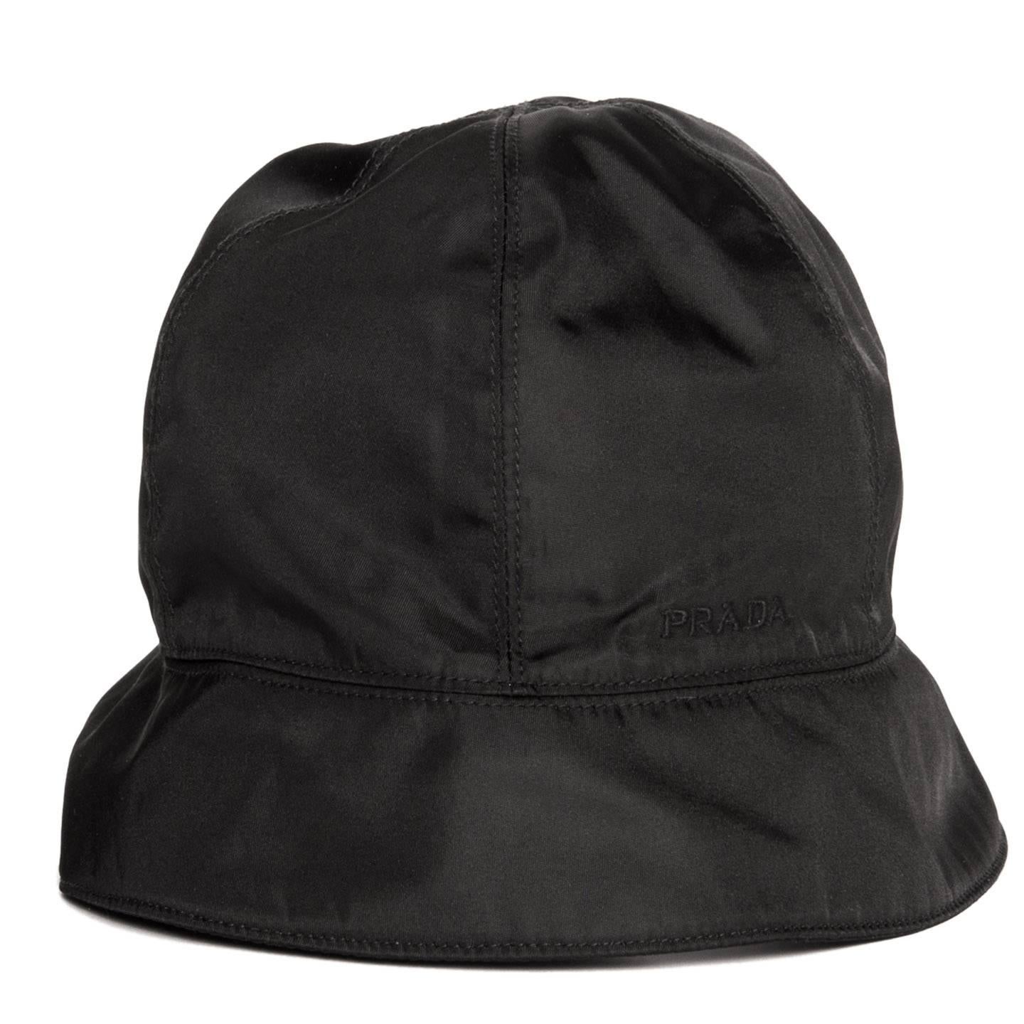 Prada Black nylon bucket cap divided in sections embellished with tone-on-tone top stitches, with a small brim and the Prada logo embroidered on the side.

Size  L Universal sizing

Condition  Excellent: never worn