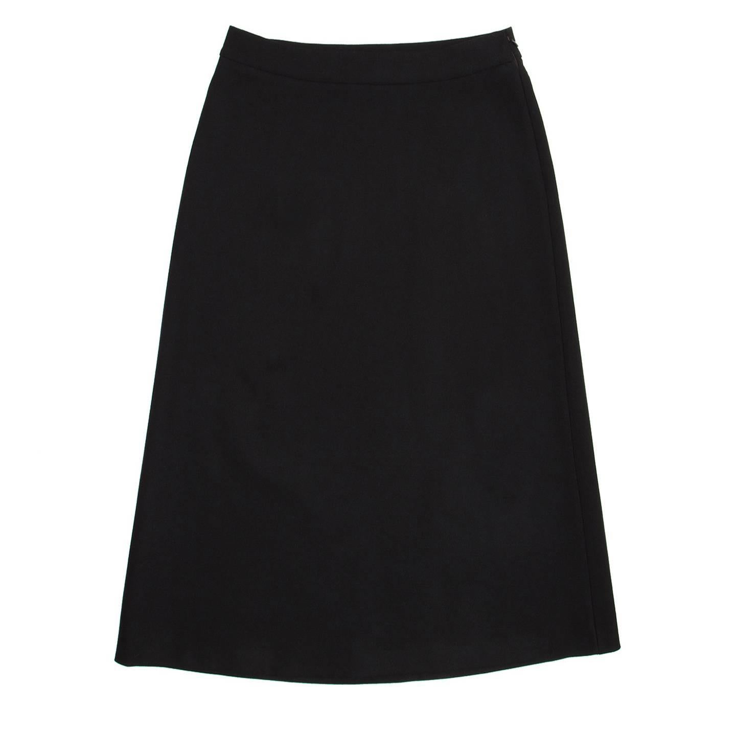 Prada black wool A-line high waisted skirt with below knee length.

Size  44 Italian sizing

Condition  Excellent: worn a few times