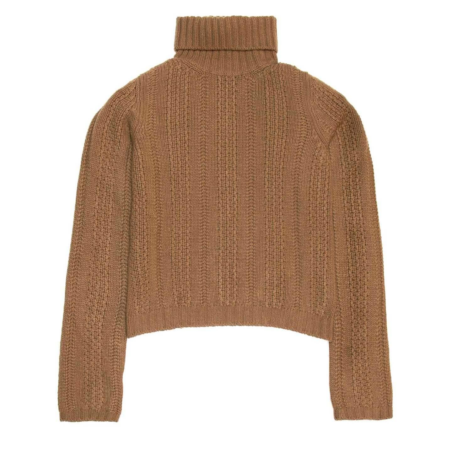 Prada camel colored fine cable knit wool and cashmere sweater. Ribbed roll down turtle neck. Ribbed hem and sleeve cuffs.

Size  44 Italian sizing

Condition  Excellent: never worn