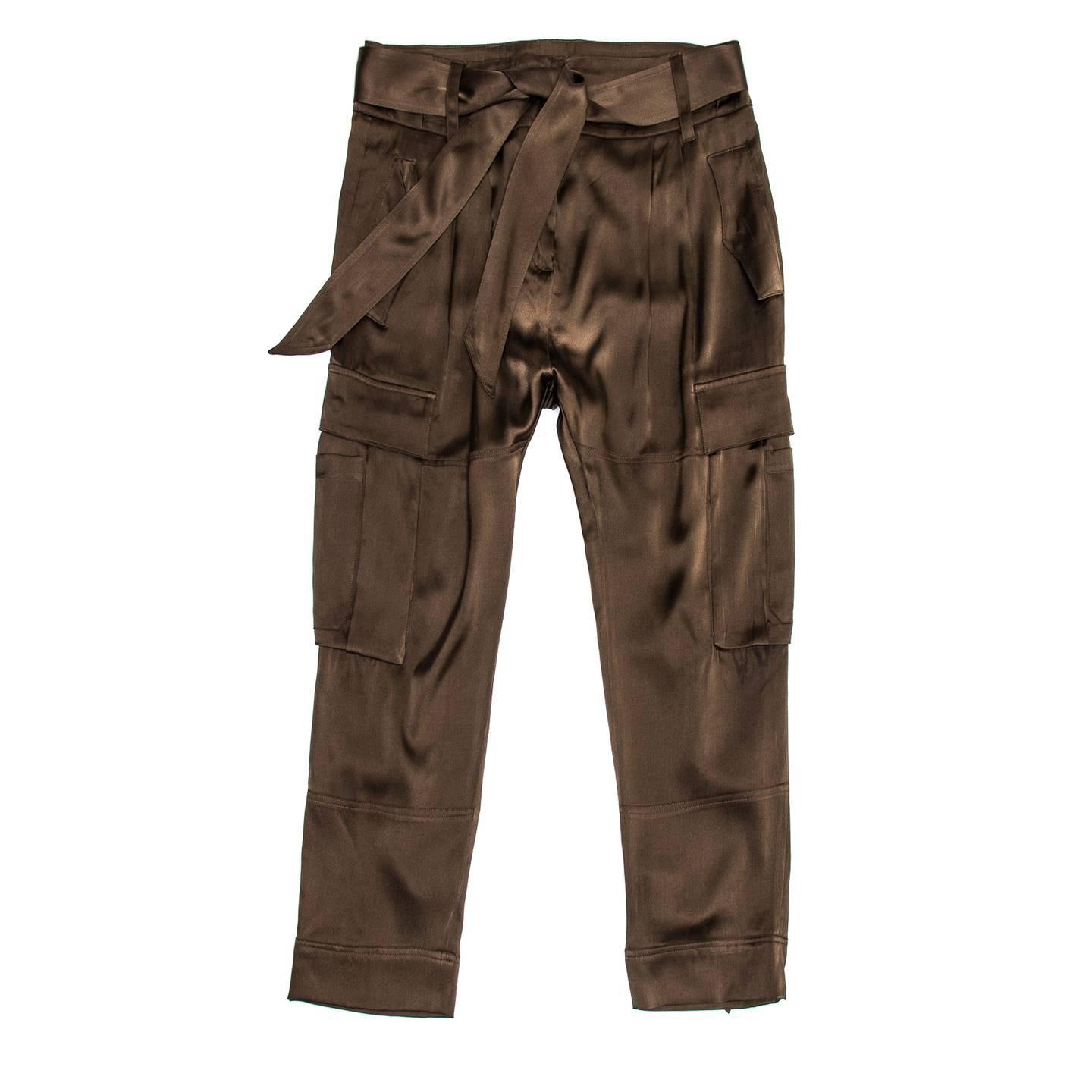 Roberto Cavalli chocolate brown stretch silk satin cropped cargo pants with bellow pockets at sides and flap pockets at hips and back. The waistband is wide and embellished with belt loops and a self-fabric belt to be fastened with a knot. The