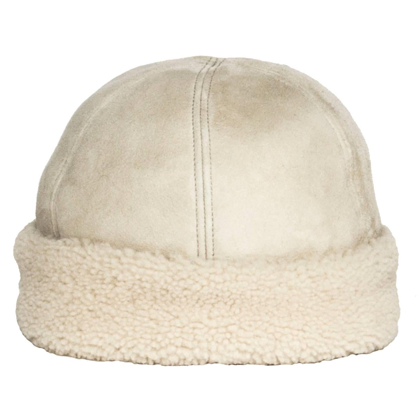 Prada ivory dyed sheep leather hat with suede exterior and shearling interior and turn-up.

Size  L Universal sizing

Condition  Excellent: never worn