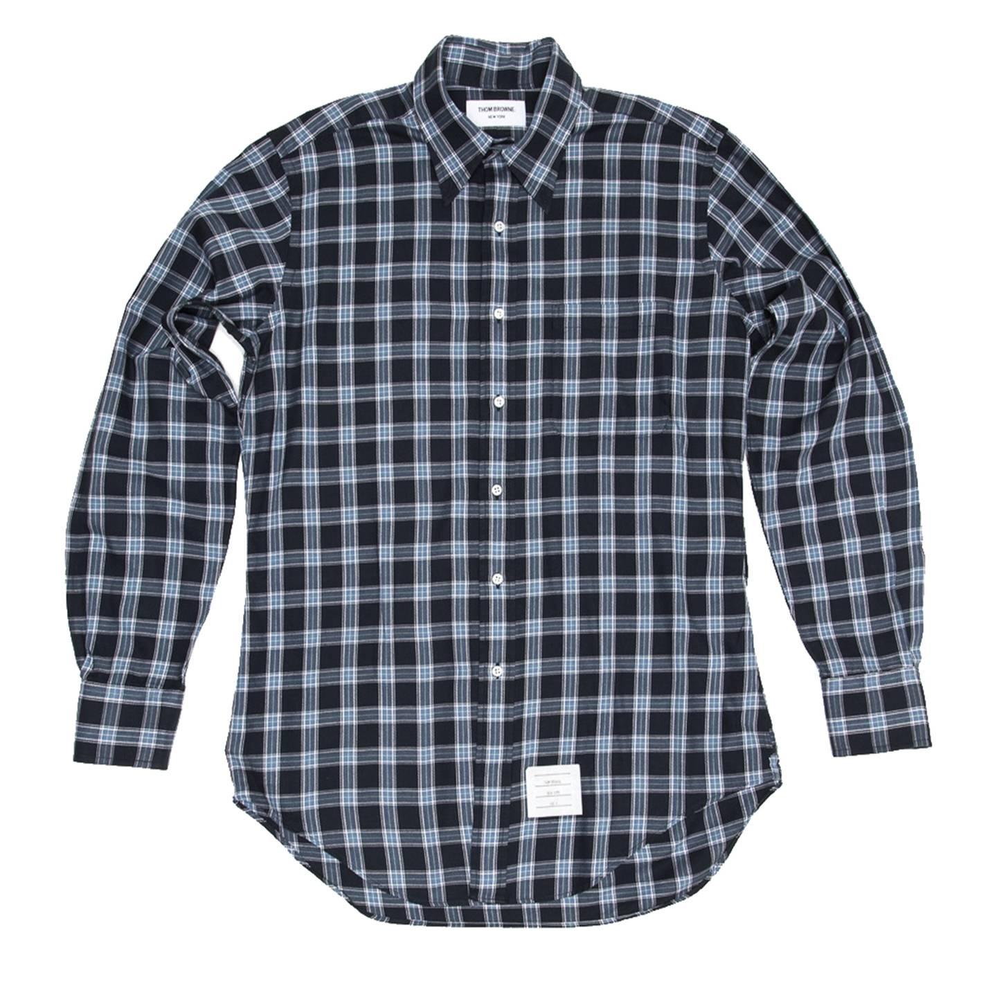 Thom Browne navy blue, baby blue and white plaid cotton flannel shirt with button down collar, white mother-of-pearl buttons and a patch pocket at bust. Made for Man. Made in U.S.A.

Size  4

Condition  Excellent: never worn