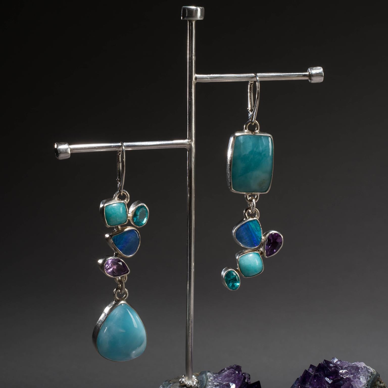 LARIMAR EARRINGS ON AMETHYST

No other stone so completely captures the exact teal and turquoise shades of the sea as larimar. Born of the volcanic activity that created the Caribbean and found only in the Dominican Republic, these soothing stones