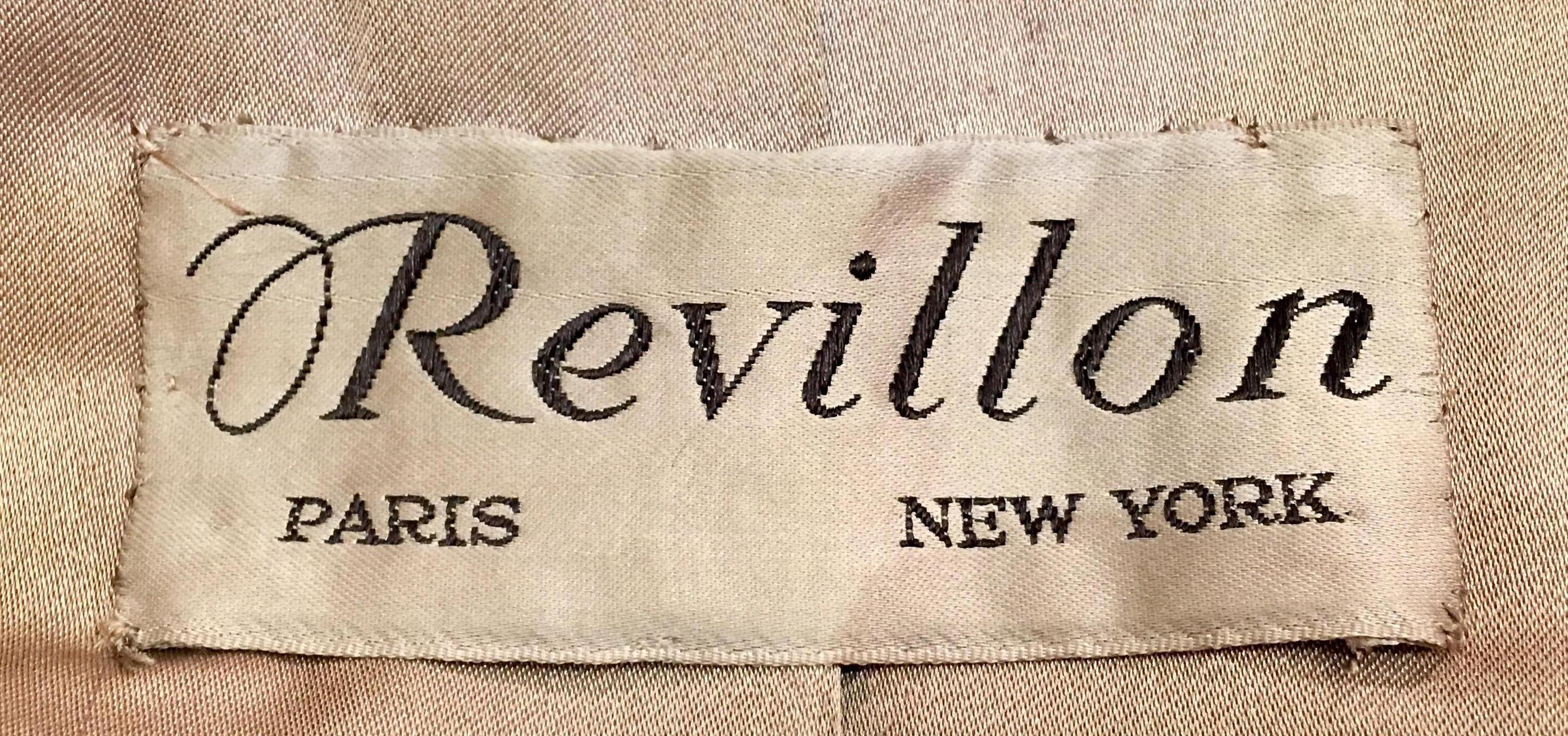 Sumptuous Siberian lynx full length fur coat by Revillion Paris New York, evokes glamour and style.  Classically tailored with a large shawl collar, hook and eye closures, slash pockets, belt openings and satiny taupe color fabric lining with velvet