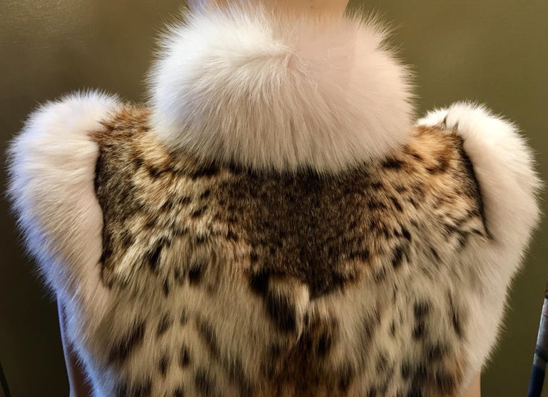 Stunning Luxurious Spotted Lynx Fur Sleeveless Vest with White Fox Fur Trim For Sale at 1stdibs