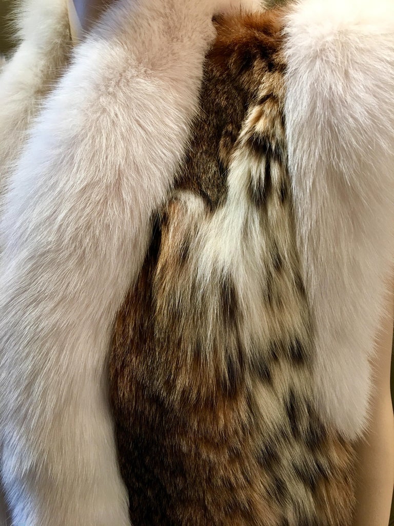 Stunning Luxurious Spotted Lynx Fur Sleeveless Vest with White Fox Fur Trim For Sale at 1stdibs