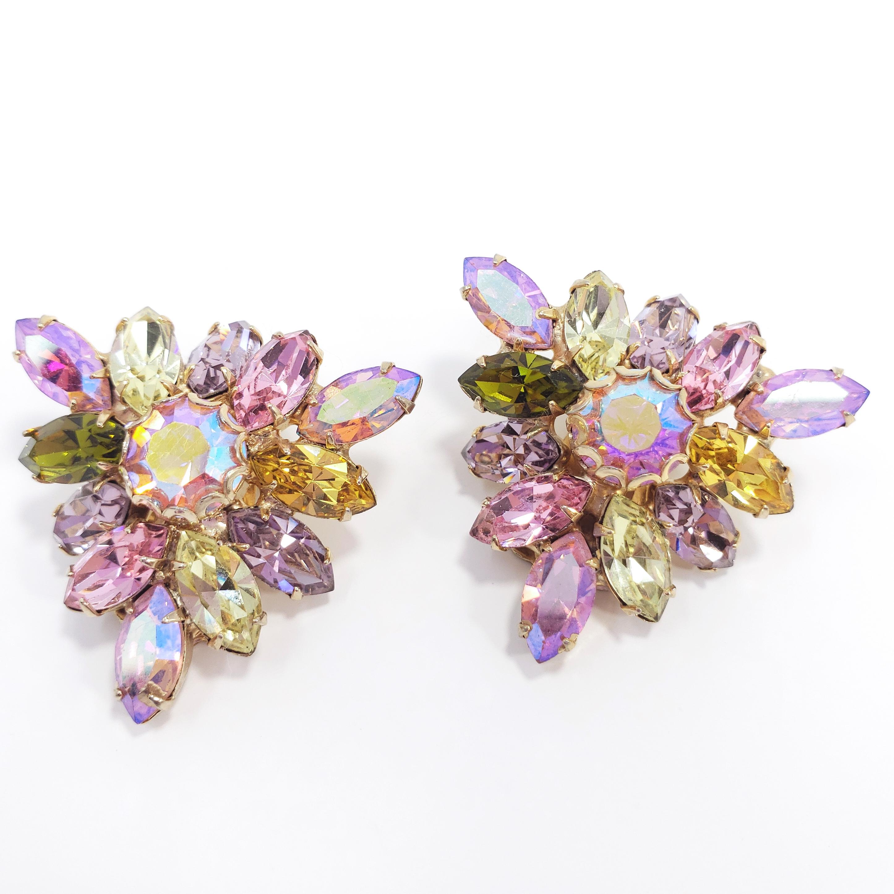 Colorful clip on earrings by Weiss. Each earring features a custom prong-set aurora borealis chaton surrounded with a cluster of aurora borealis, rose, amethyst, peridot, and olive navette crystals. Geometric, triangular, art-deco shape.

Hallmarks: