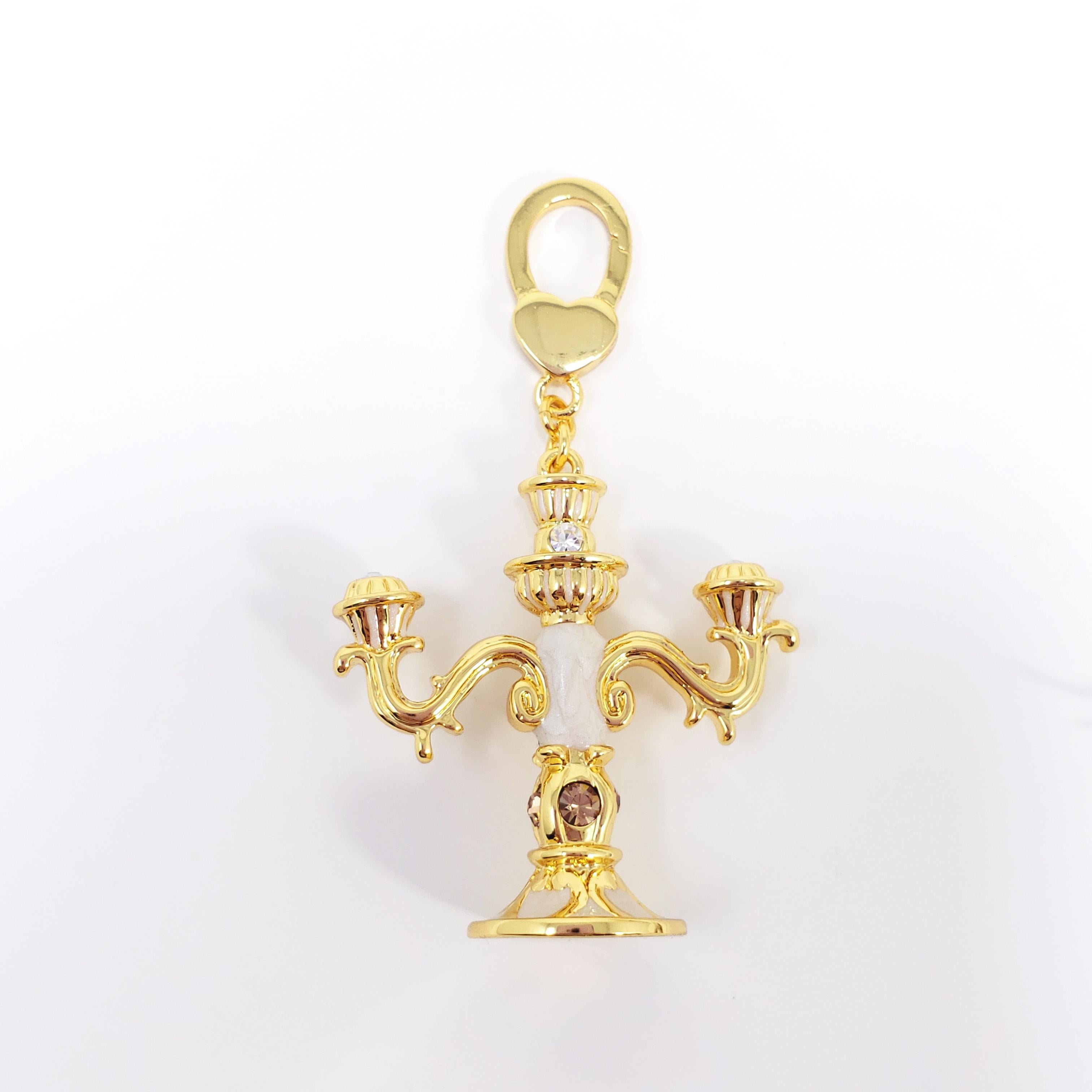 A whimsical candlestick charm, painted with white enamel and accented with clear crystals. Can be worn as a bracelet charm, a necklace pendant, or in a multitude of other creative ways.

Hallmarks: Jay, Jay Strongwater, CN

By Jay Strongwater,