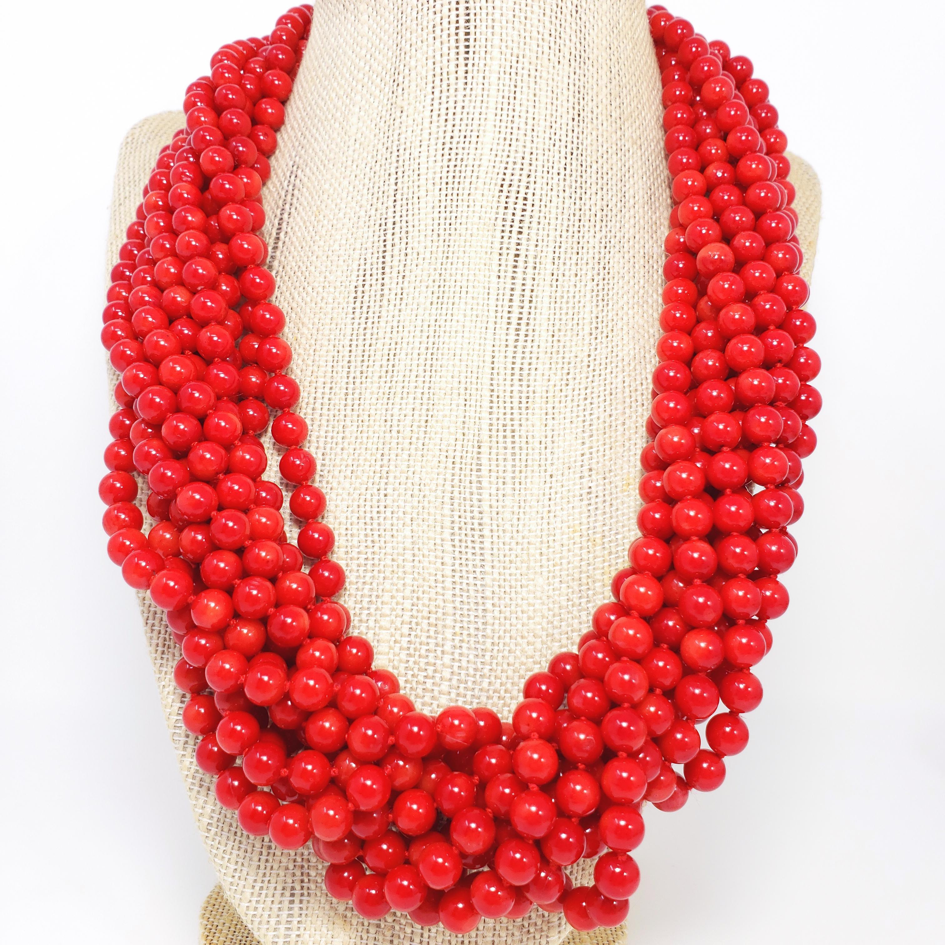 An exquisite necklace featuring 10 strands of 7mm genuine red, sea coral beads on an accented sterling silver sliding clasp. Vibrant, natural, rich red color, in mesmerizing style. Fit for a queen!

Excellent quality.

Dimensions: 57 cm in length.