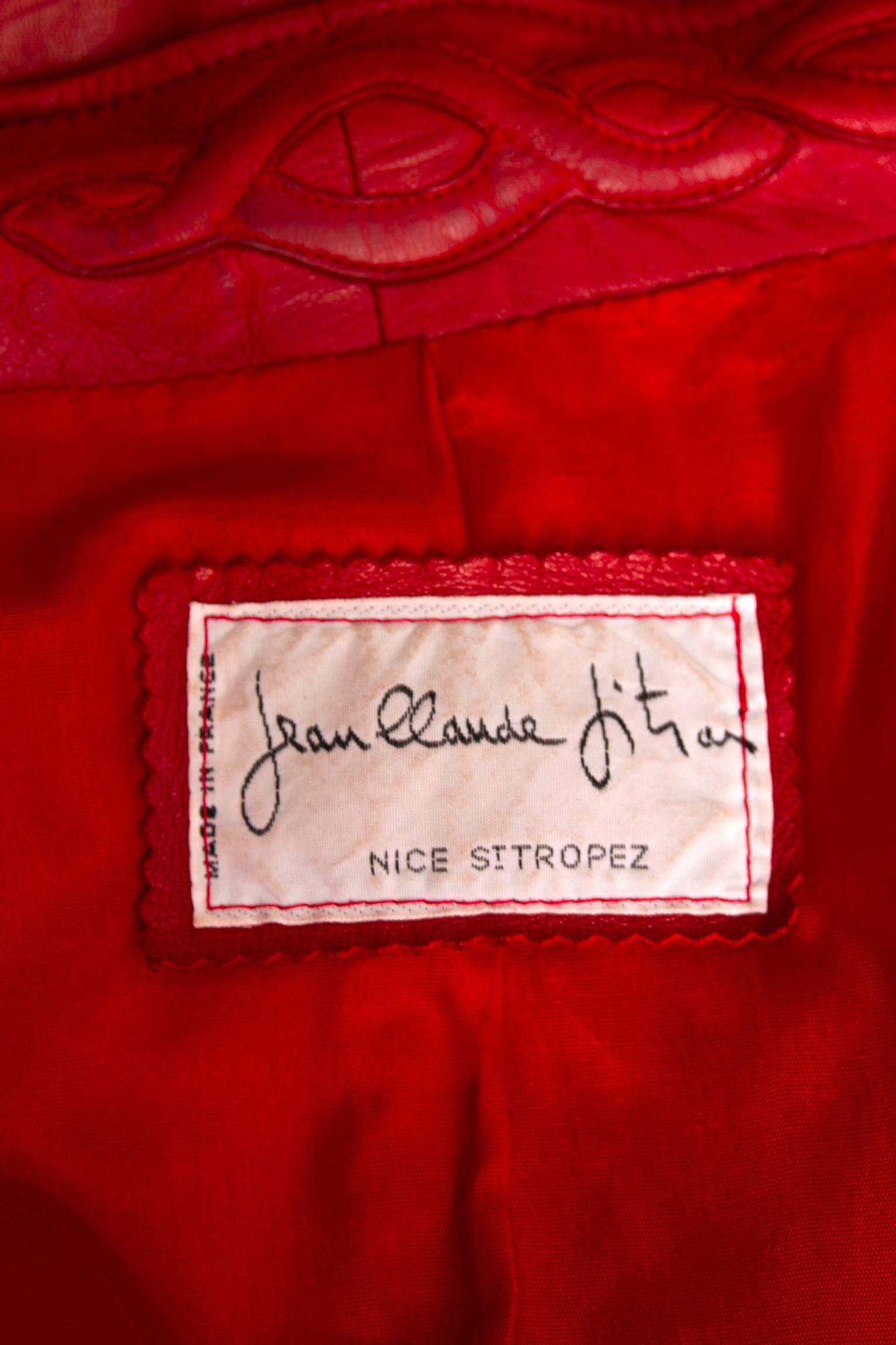 An incredible soft and glamorous 1980s Jean Claude Jitrois bright read leather jacket with exaggerated shoulders, voluminous sleeves and an open front which can be held in place by a matching detachable waist belt. The slim collar features a braided