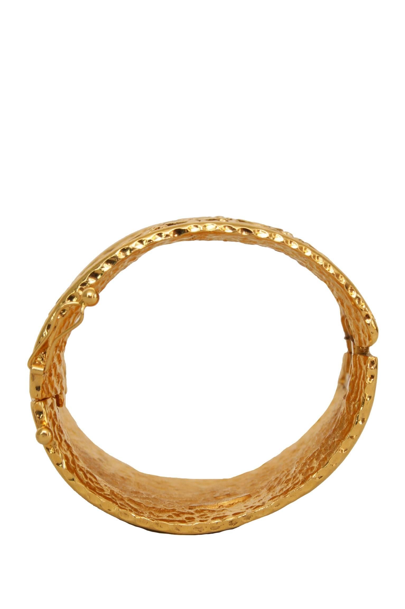 Women's or Men's An Engraved 1980s Gold-toned Chanel Cuff Bracelet