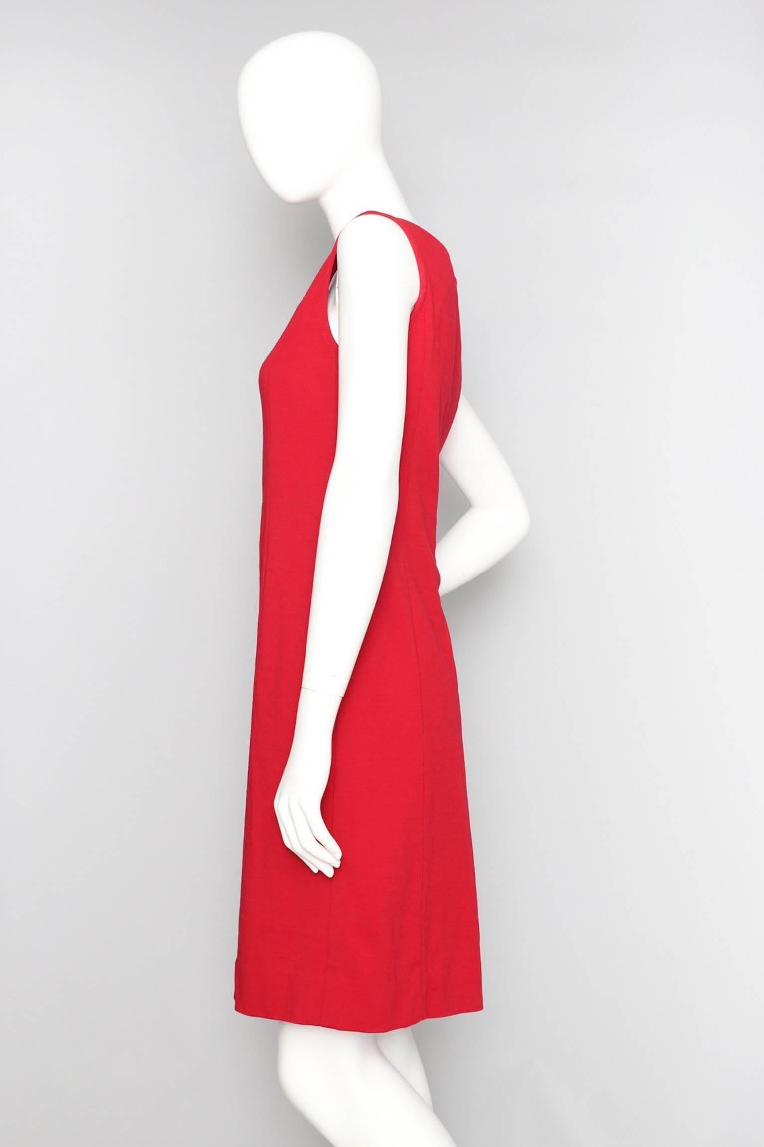 A gorgeous sleeveless 1960s Pierre Cardin bright red mod dress . The four round circles descend in size beginning with the largest at the top and the smallest at the bottom. The dress is fully lined with a matching nylon and has a back zipper and