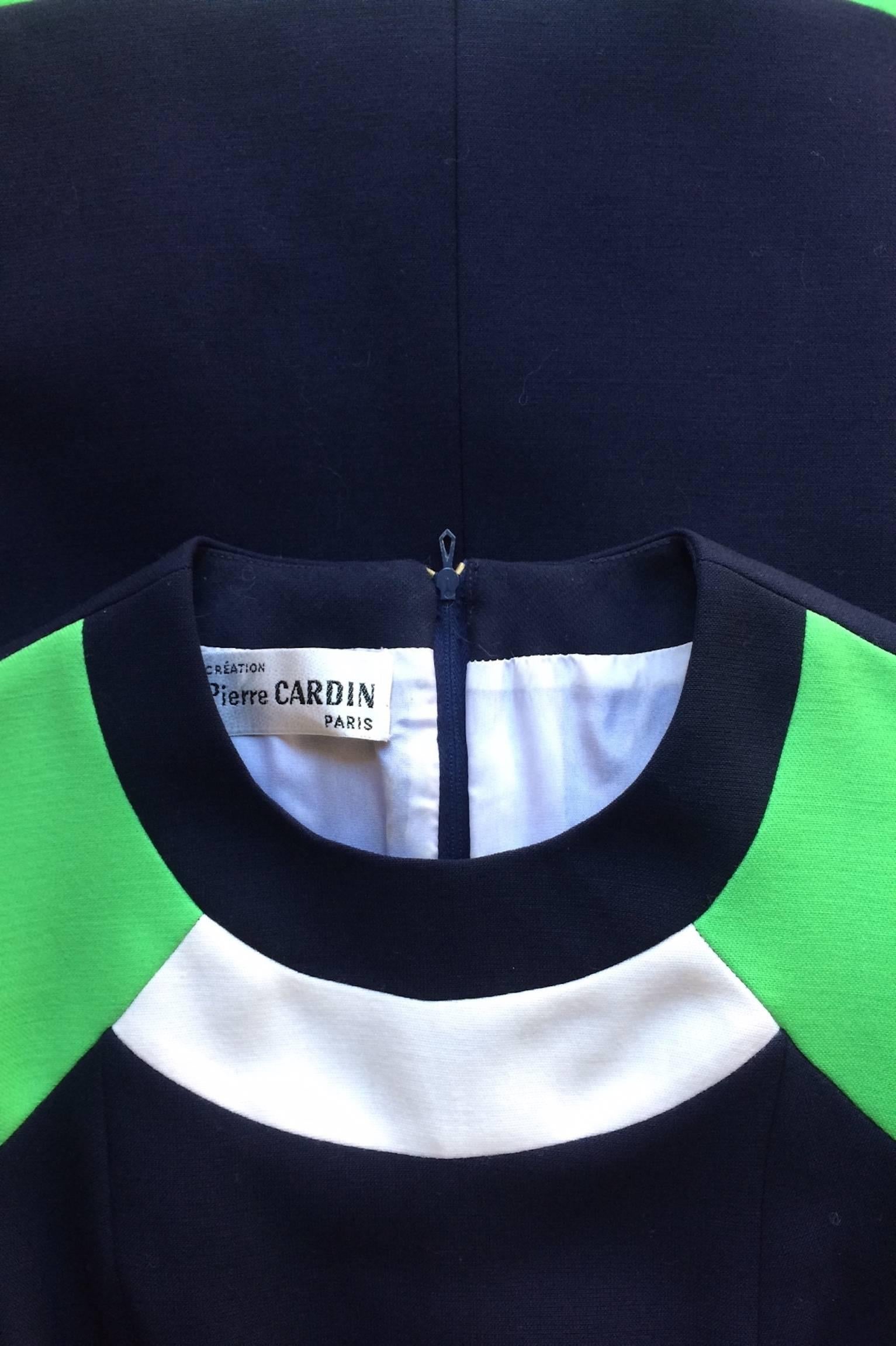 A fabulous 1960s Pierre Cardin navy wool/silk blend Space Age dress with white and lime green paneling. The gorgeous dress has short sleeves and a narrow waist. 

The dress is fully lined. 
The size of the dress corresponds to a modern size Small. 