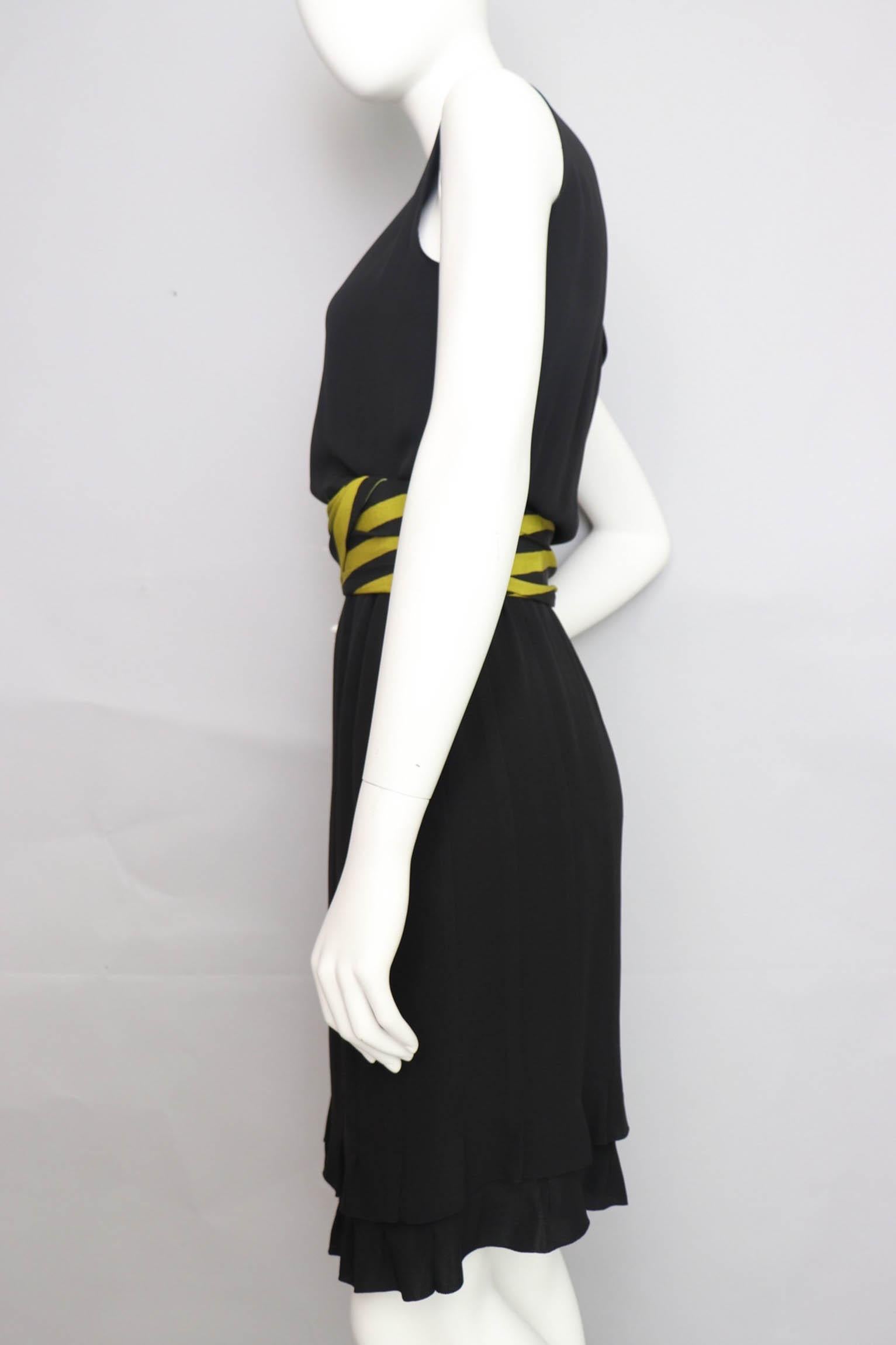 A fabulous little black Christian Dior haute couture silk dress dating from the 1981 spring summer collection. The dress has a round neckline, a fitted waist, and gorgeous square, double layered flared hemline. The dress has a back zipper and