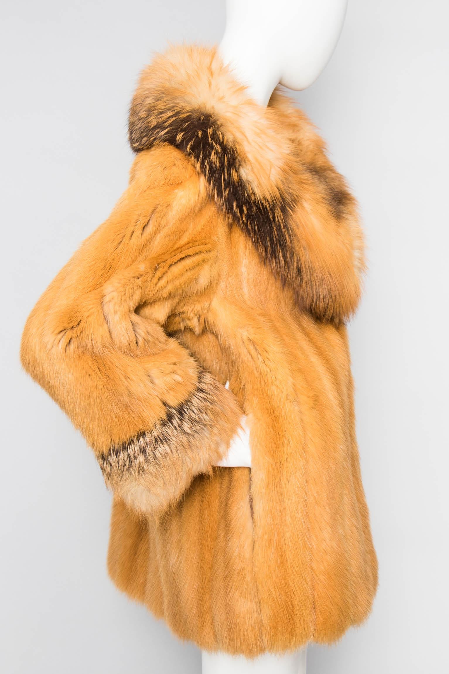An incredible 1980s Birger Christensen Canadian fox fur coat with an extravagant collar and cuff trim. The jacket closes in the front and has side pockets. 

The size of the coat corresponds to a modern size small, but please see the measurements