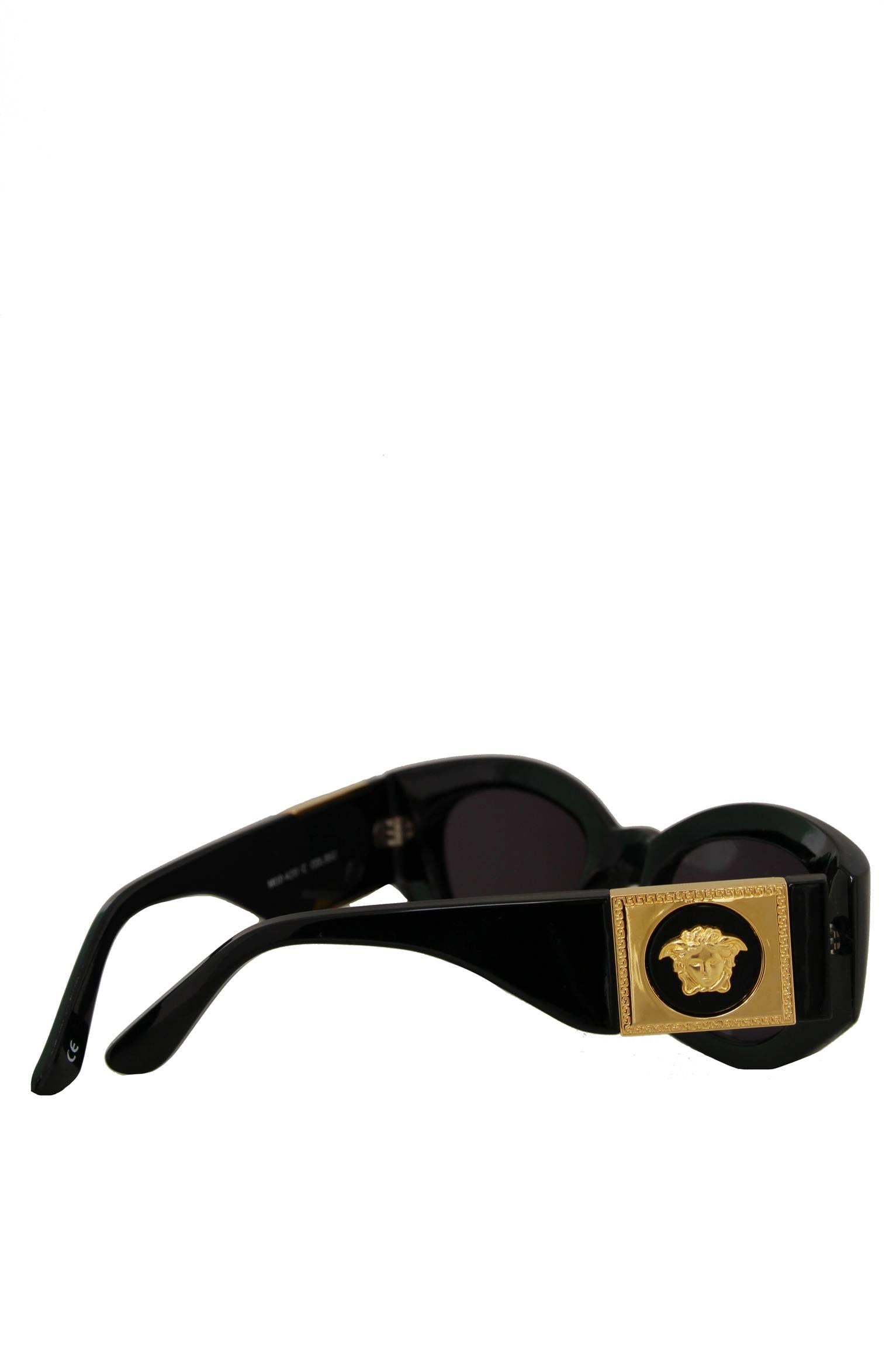 Women's or Men's A Pair of 1990s Gianni Versace Black Frame Sunglasses W. Gold Colored Medusa