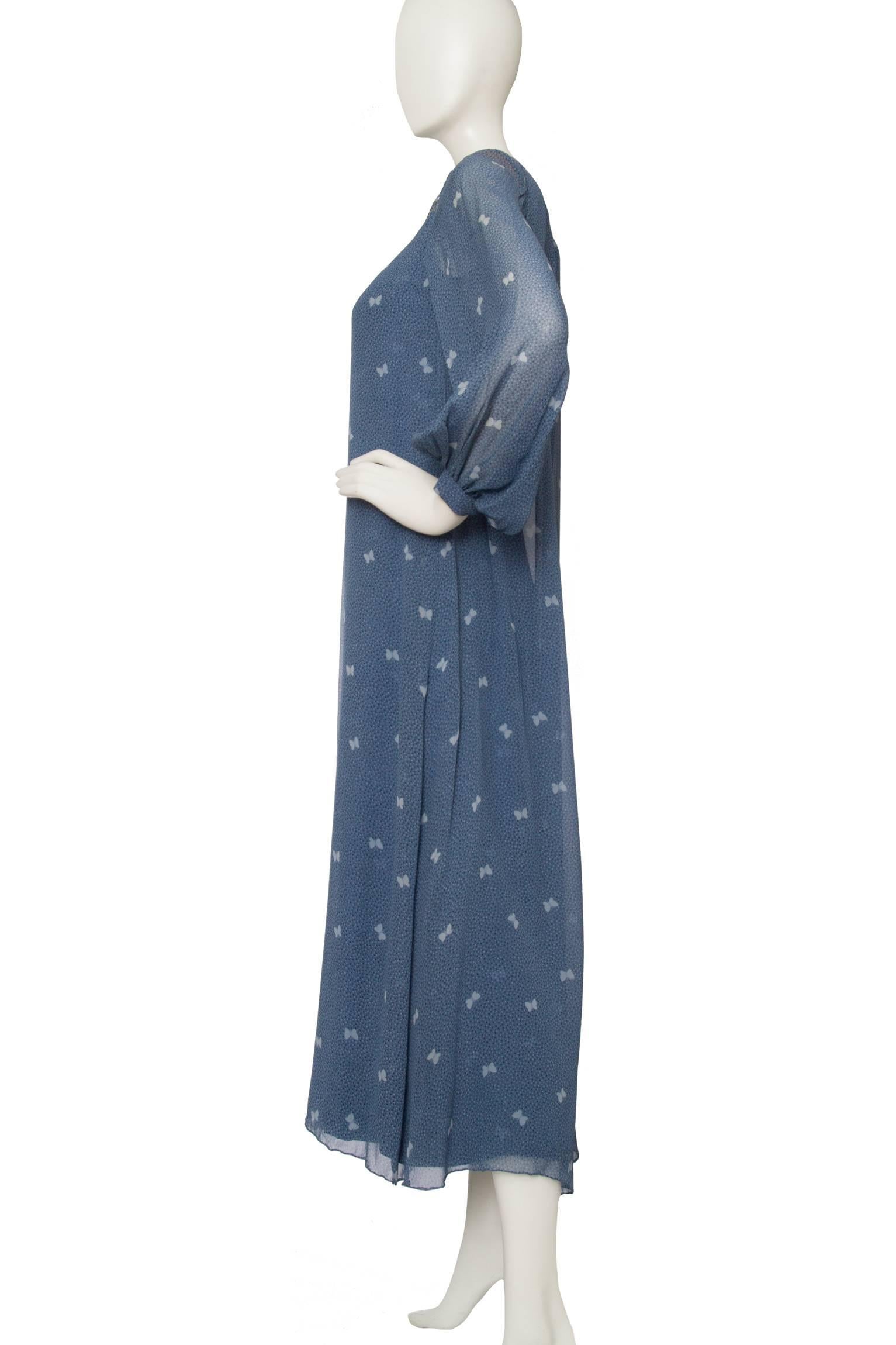 An absolutely stunning 1970s blue Hanae Mori floor-length silk dress with long sheer blouson sleeves with fitted cuffs and an embellished panel across the bust. The dress has multiple layers and a sheer overlay which is split down the front &