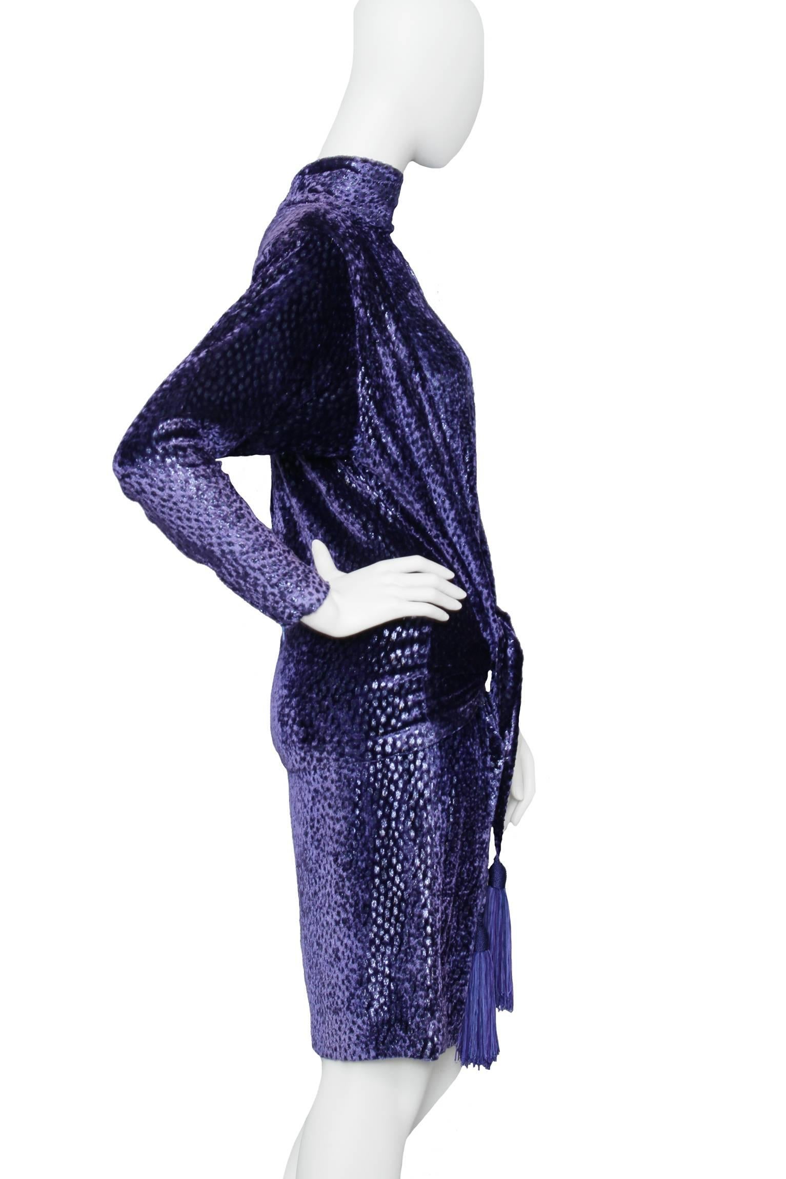 A great 1980s Christian Dior dark blue velvet cocktail dress. The dress has long tapered sleeves with a zipper detail at the cuff, large shoulder-pads for extra glamour, a round neckline and a layered hemline. 


The size of the dress corresponds to