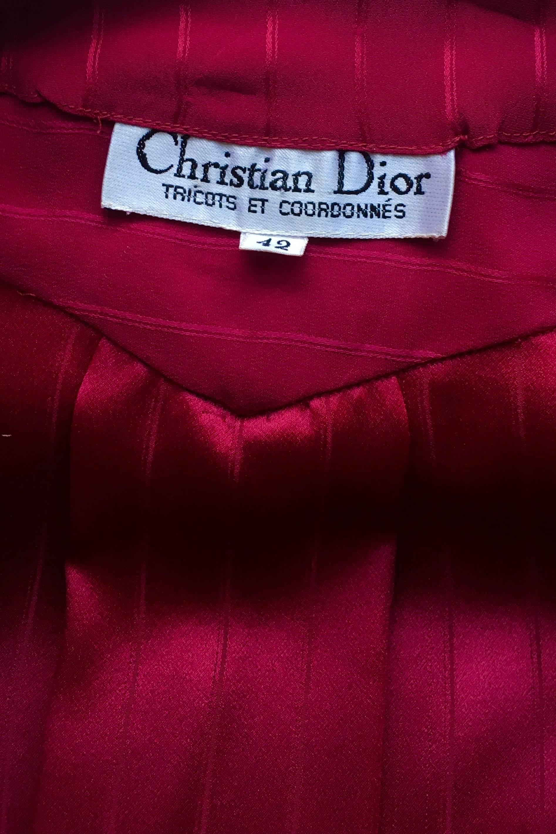 A great 1980s Christian Dior red jacquard woven silk ensemble consisting of a-line wrap skirt and a wrap front blouse. 
