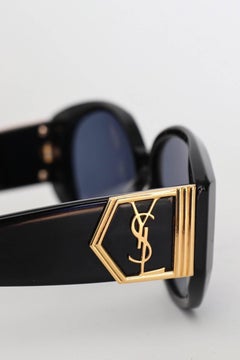 A Pair of 1980s Black Yves Saint Laurent Gold YSL Logo Detail Sunglasses