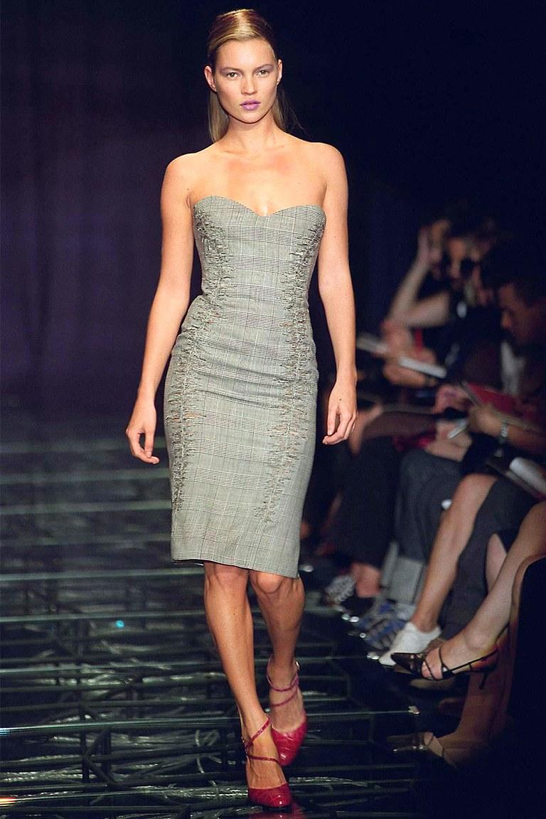 A 1998 spring/summer Gianni Versace iconic houndstooth plaid cocktail dress from the first Versace collection under the lead of Donatella Versace. 

The size of the dress corresponds to a modern size Extra Small.