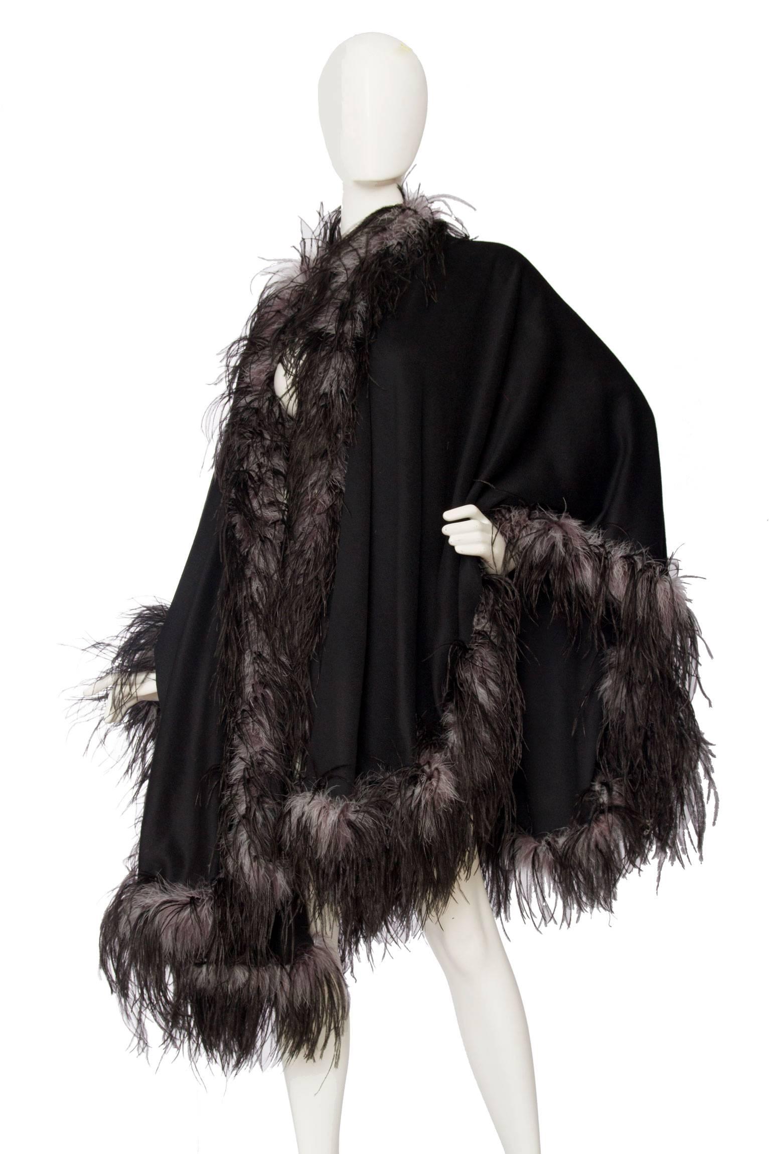 An absolutely stunning 1980s Emmanuelle Khahn thin black wool cape with a trim of voluminous black and grey ostrich feathers