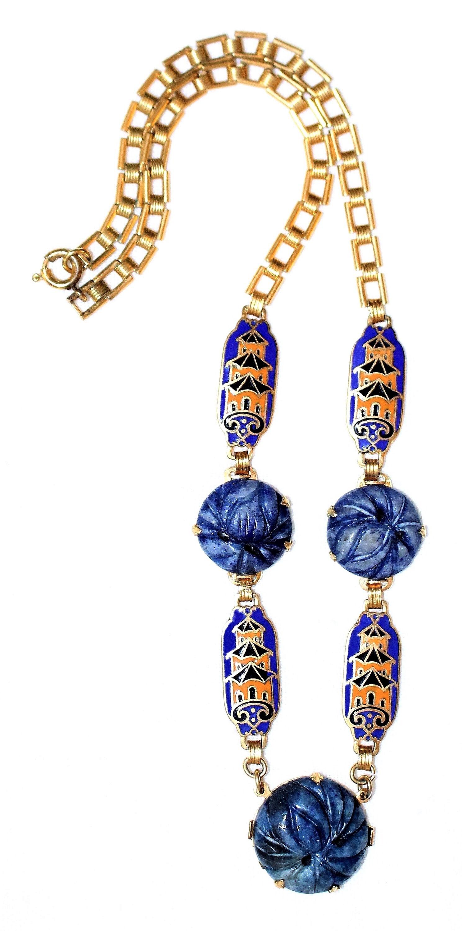 Circa 1940s gold tone chain link necklace prong set with three molded faux-sodalite stones and embellished with cloisonné enameled links in a pagoda motif.  The necklace measures 16