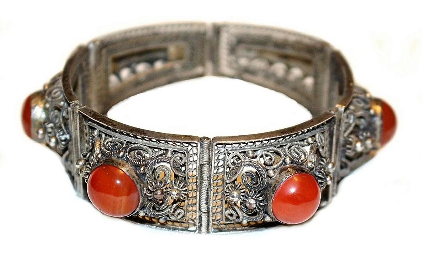 Circa 1940 Chinese silver-plated copper filigree link bracelet bezel set with round carnelian cabochons.  Safety chain. Marked: China.  Good condition with minimal wear to plating.  Please note, item will ship after May 26th. 