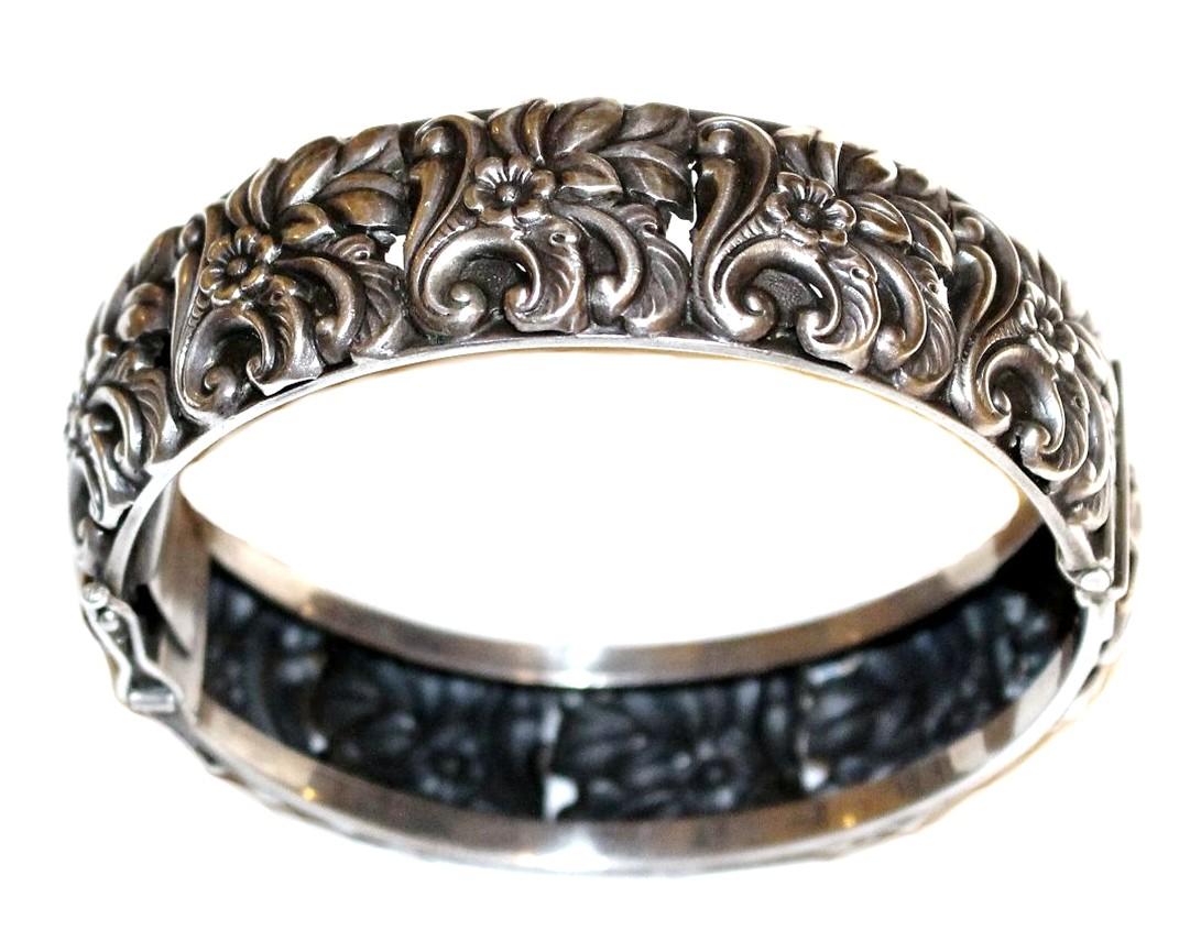 Women's Circa 1950s Sterling Silver Floral Repoussé Hinged Bangle For Sale