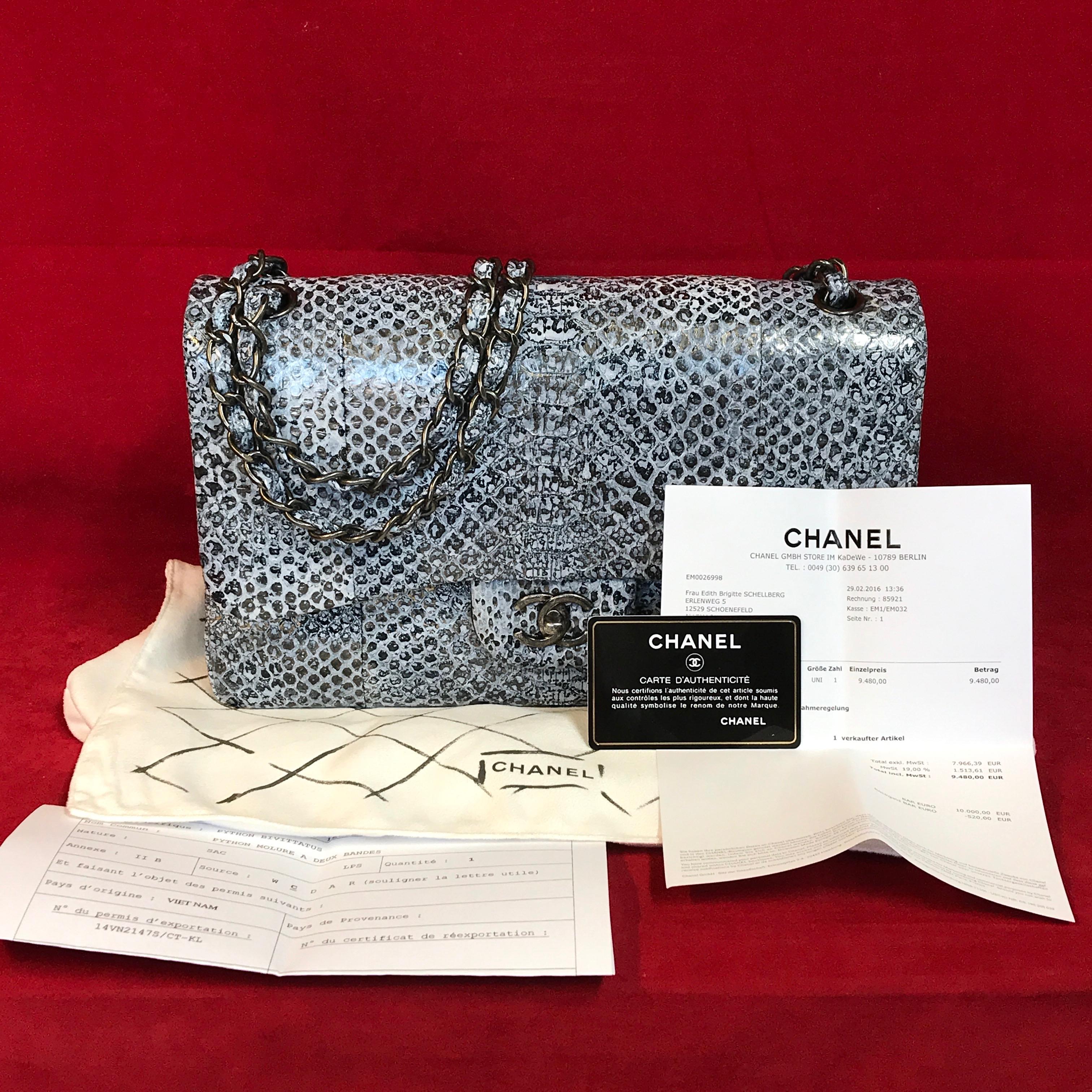 Extremely rare CHANEL double flap Bag Jumbo made of python leather.

The bag is brand new, never worn and has no signs of wear. A real dream piece for Chanel lovers and collectors.

The delivery includes:
- Chanel double flap bag Jumbo python