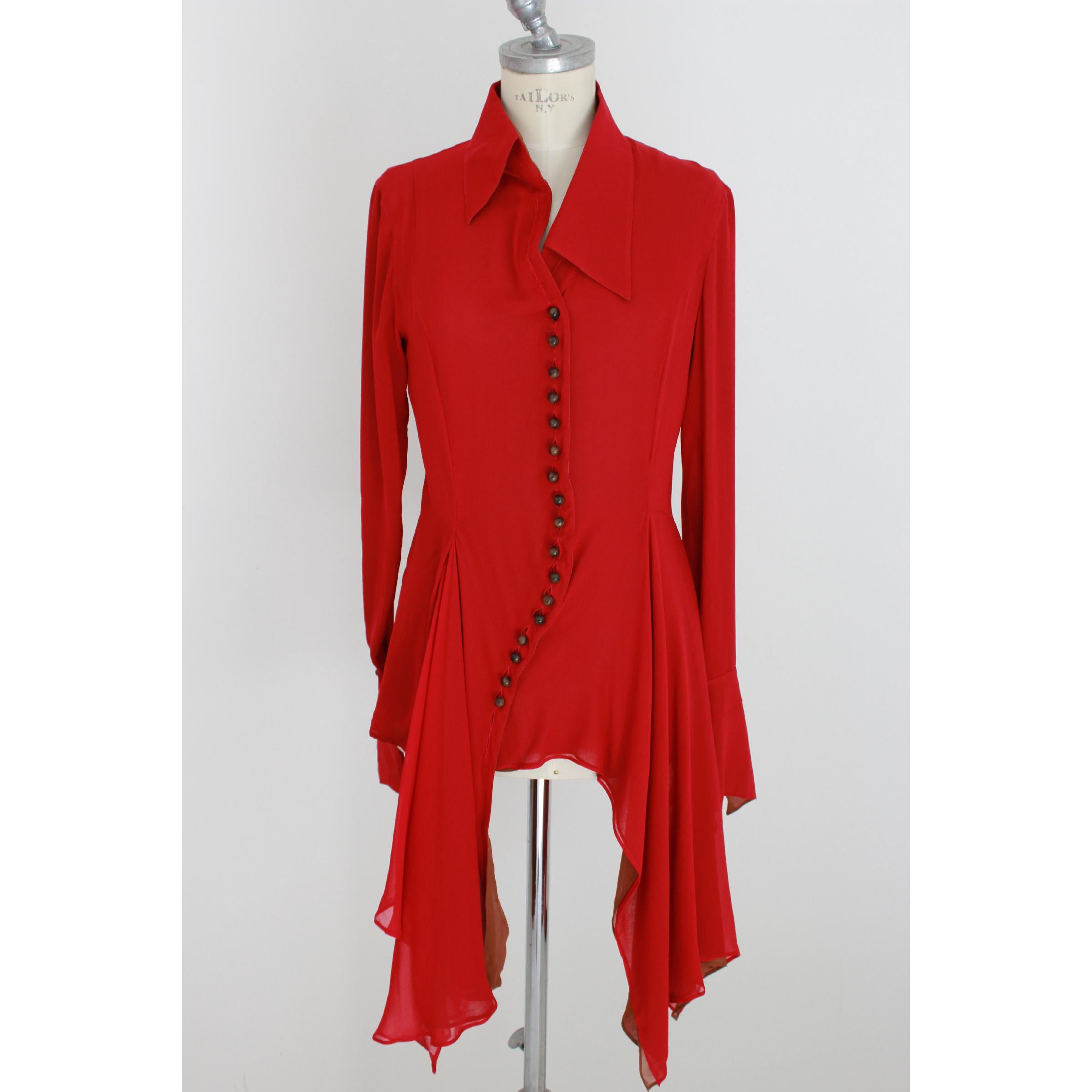 Gianfranco Ferre vintage women's shirt, red, 100% silk. Asymmetric model with long tails on the front. Brown color interior. Pointed collar, sleeve with long cuff. Shirt produced only for Japan. Excellent vintage conditions. Made in Italy.
Size: 44