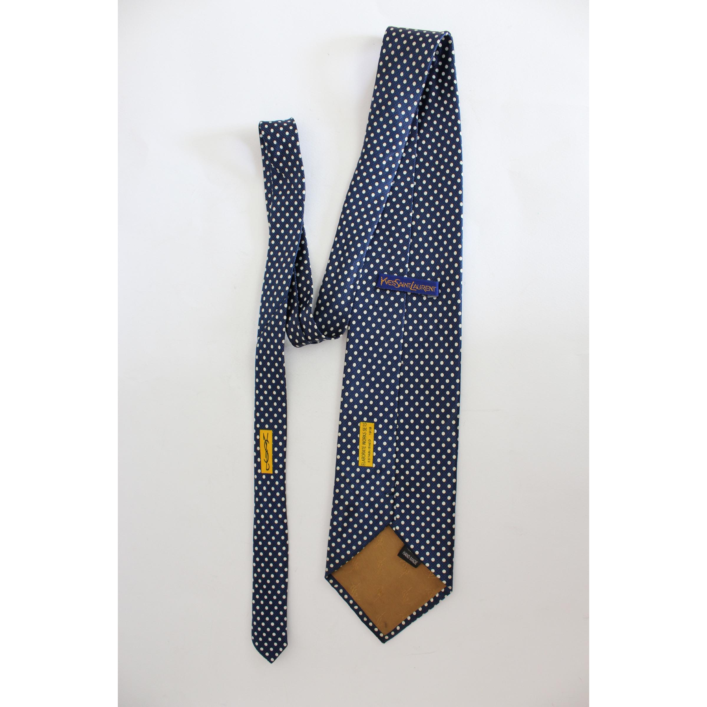 Handmade vintage tie Yves Saint Laurent, blue with white polka dots, 100% silk. Made in Italy. Excellent vintage conditions.

Length: 144 cm
Width: 10 cm