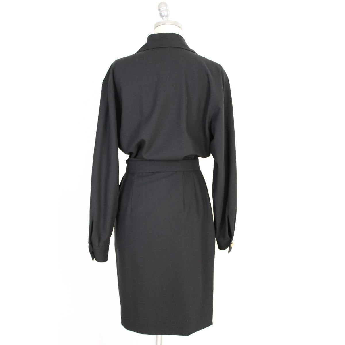 Salvatore Ferragamo black wool cocktail dress. Long-sleeved dress, wallet skirt. Gold-colored jewel button. Waist belt with golden medallion with logo. Silk lined skirt. Two side pockets. New with label. Replacement buttons included.

Size 44 It 10
