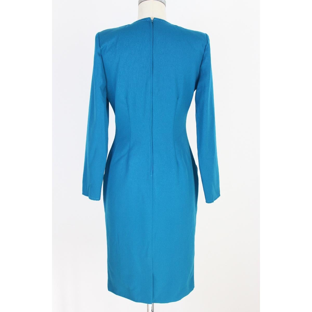 Mila Schon vintage sheath dress woman 1980s. Beautiful 100% wool turquoise fabric. Made in Italy, size 42. New with label.

Size 42 It 8 Us 10 Uk

Shoulders: 42 cm
Chest / Bust: 49 cm
Sleeves: 60 cm
Length: 103 cm