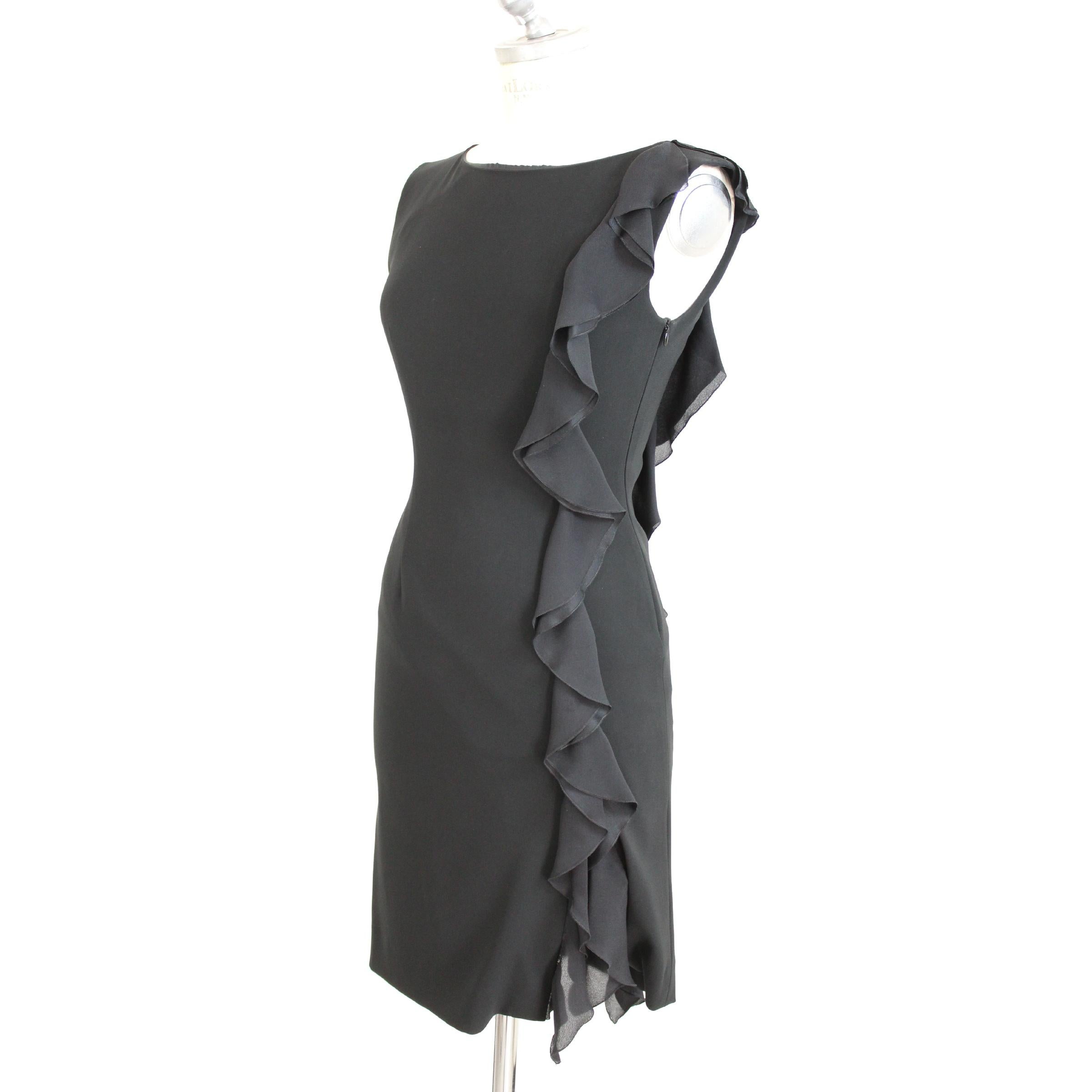 Moschino Cheap and Chic evening dress. Color black sheath dress model. Sleeveless round neck with applications along the left side both front and back. Zip closure. Made in Italy. Excellent vintage conditions. Fabric: 64% triacetate 36%