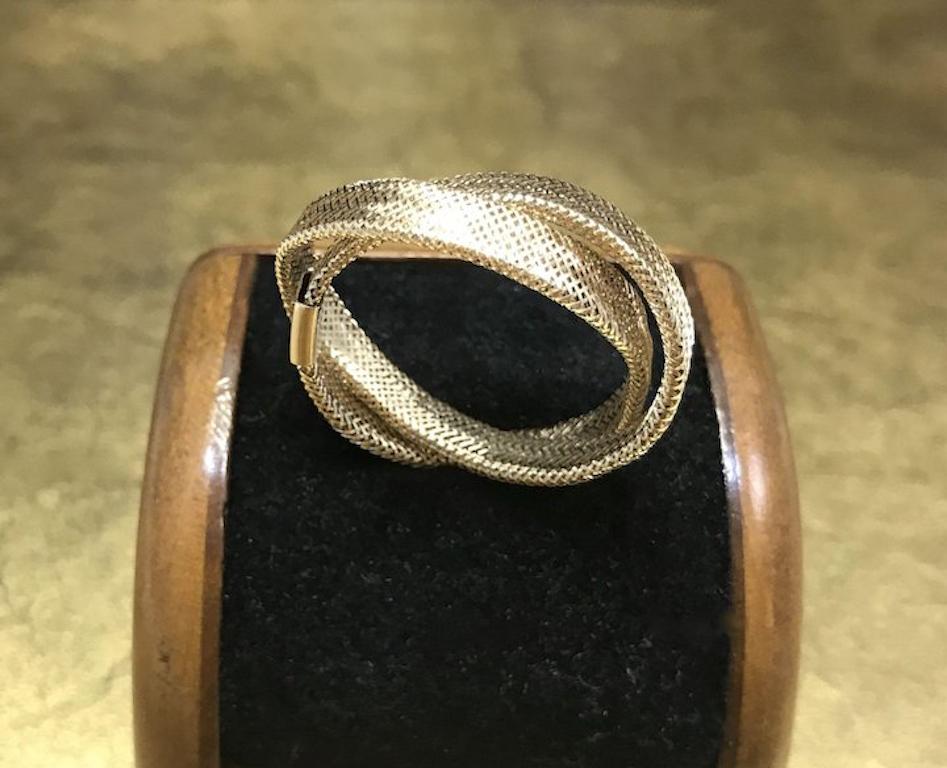This vintage 1970s gold statement band is crafted with 14k yellow gold and features and unique double woven mesh band design. This unique gold ring would make an excellent wedding band, anniversary gift, statement ring, birthday gift, Mother's Day