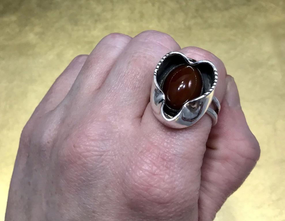 This unique Minimalist ring dates back to the Mid Century 1960's, is artist signed, crafted with sterling silver, and features an oval cabochon cut carnelian quartz stone. This this unique mens ring would make a great birthday gift, anniversary
