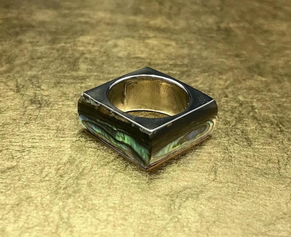 This unique shell ring is crafted with Mexican Taxco 800 silver and features beautiful abalone - paua shell and an interesting geometric square shaped design. This vintage abalone ring would make a wonderful birthday gift, anniversary gift, Mother's