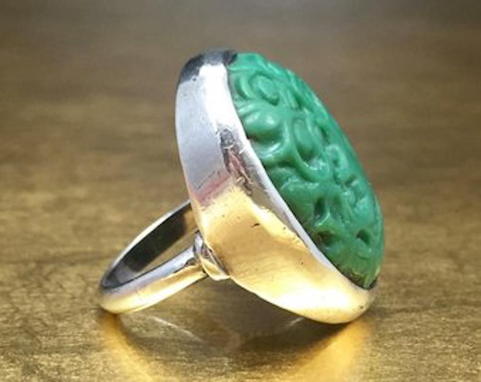 This stunning green turquoise ring would be perfect for any collection. Crafted with 800 silver, this unique green ring features a gorgeous green turquoise stone with a carved elephant - Asian - Arts and Crafts Era design. This wonderful silver