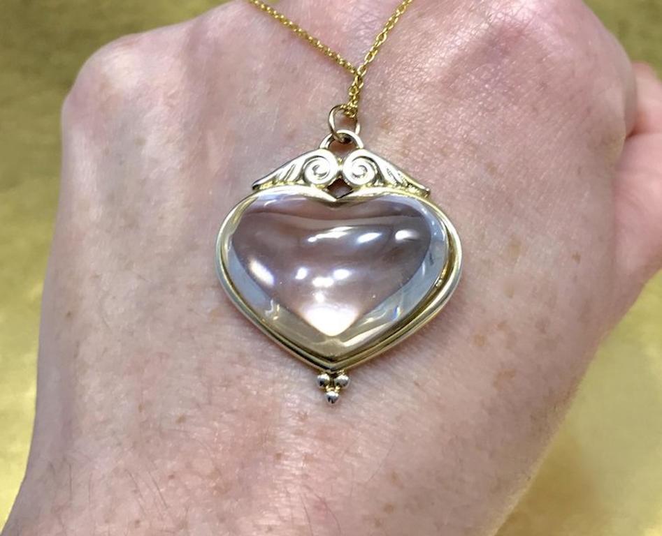 This unique Victorian pendant is crafted from gilded sterling silver and features a lovely heart shaped rock crystal. This unique heart pendant would make a wonderful anniversary gift, birthday gift, Mother's Day gift, Grandparent's Day gift, and