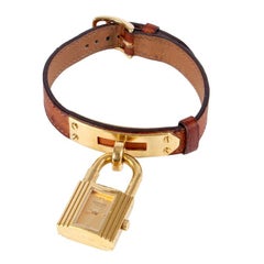 Montre KELLY HERMES plaquée or & cognac bracelet cuir d'autruche