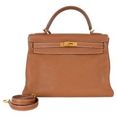 Bolso KELLY 32 RETOURNE de HERMES, en piel Togo color camel dorado, GHW