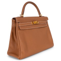 Bolso KELLY 32 RETOURNE de HERMES, en piel Togo color camel dorado, GHW