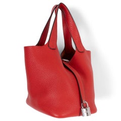 Bolso PICOTIN 18 LOCK de HERMES, en piel Clemence roja «Rouge Tomate», PHW