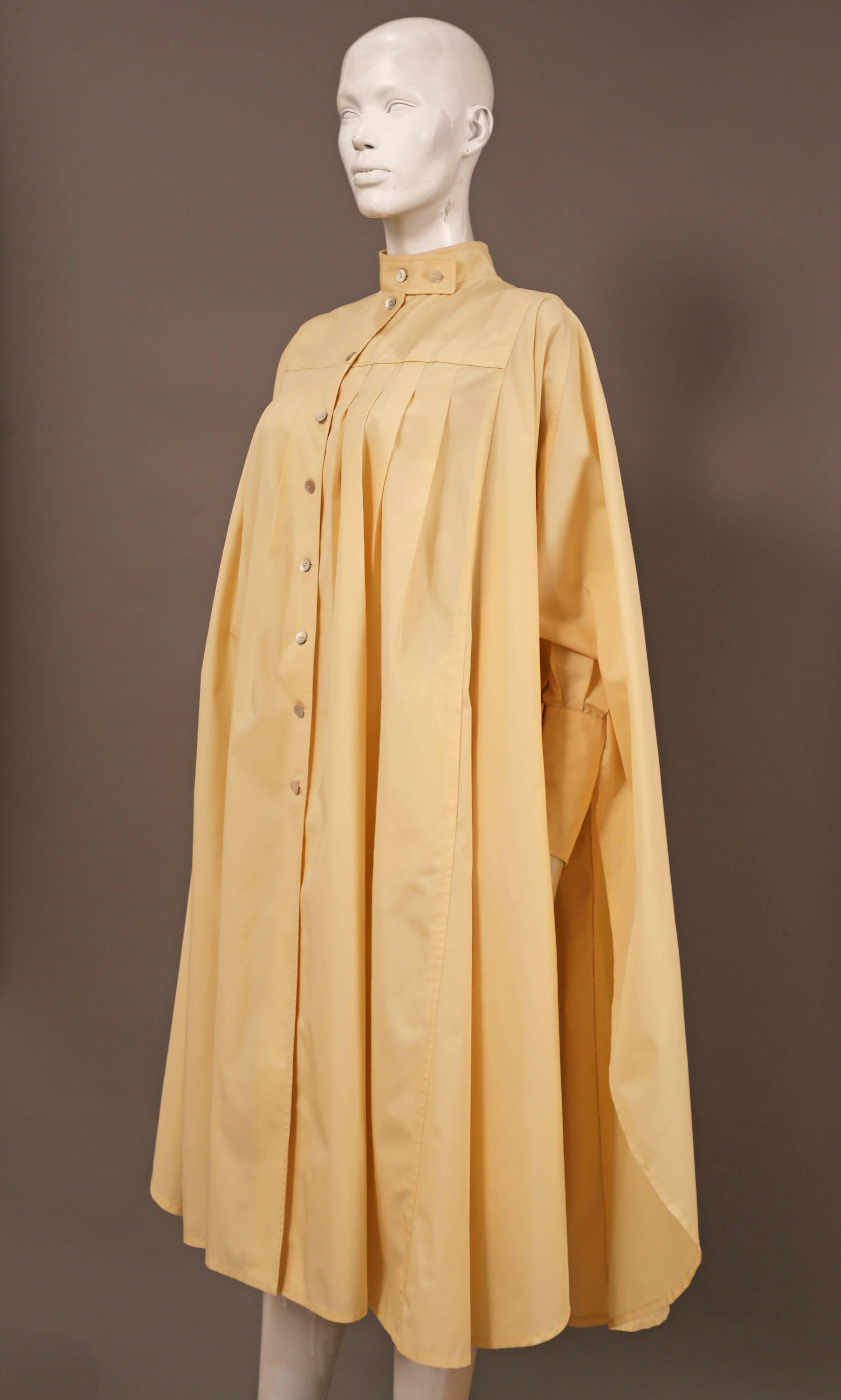 Extravagant pleated opera coat by Bill Gibb from the autumn-winter 1978-79 collection. The coat features shell button closure, high standing collar, two hidden side pockets, box pleats and extra long cuffs. 

UK 10  EU 38 

+ please note that